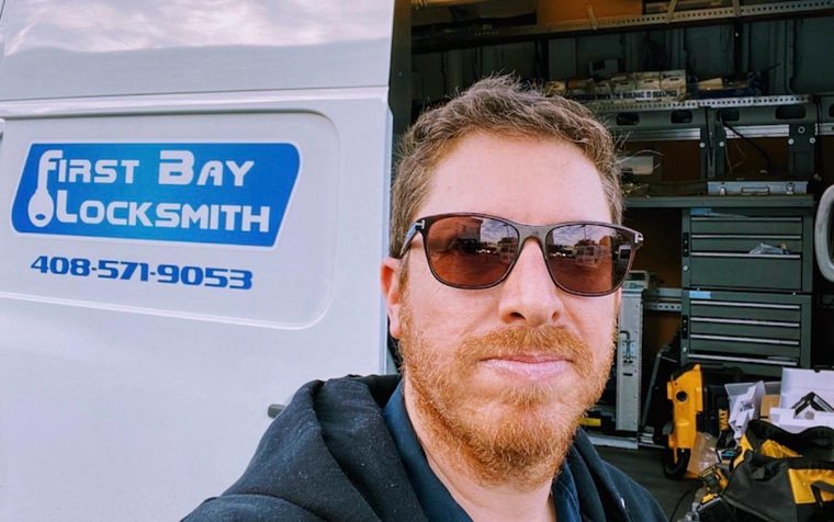 First Bay Locksmith owner and technician in front of service van